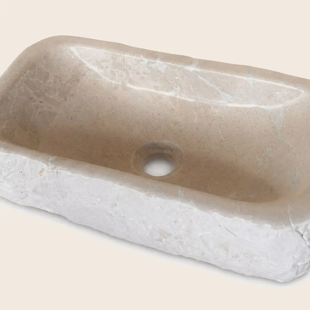 Pica de lavabo de pedra amb la vora escantonada
